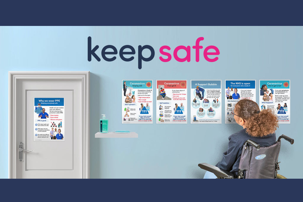 A woman in a wheelchair is looking at a 6 posters about coronavirus on the wall. One of the posters is pinned to a door. Next to the door is some handwash on a shelf. Above the posters is the Keep Safe logo.