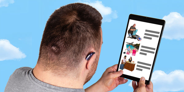 An over the shoulder image of a person looking at some easy read on a tablet screen with prominent pictures.