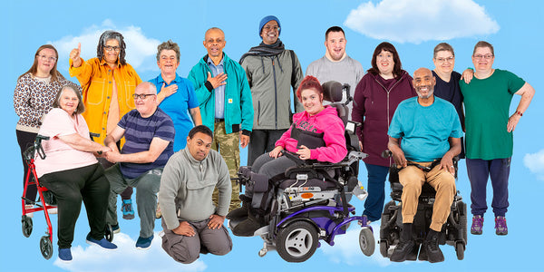 A varied group of Photosymbols actors smile in a group scene.