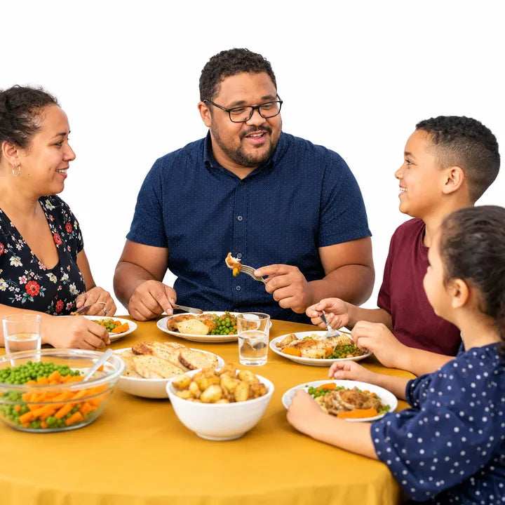 A mum, a dad and two children eating dinner together around a golden table.